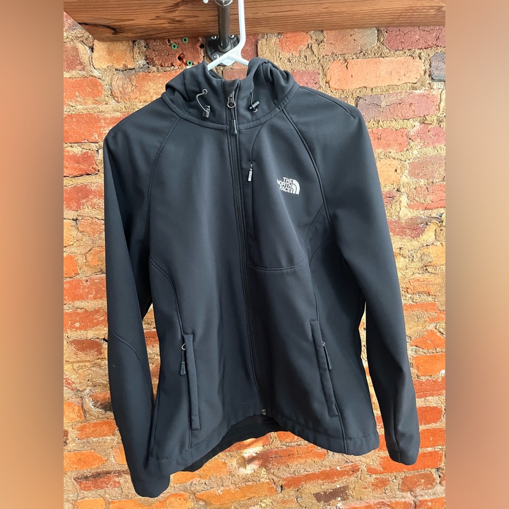 The North Face women’s hooded hybrid shell jacket. Black size L large.